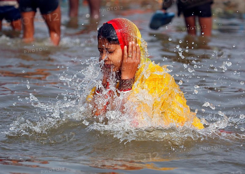 Allahabad, India, 20.01.10 - Hindus meet at Magh Mela in Allahabad to take a holy bath at the Sangam at the confluence of the Ganges, Yamuna and Saraswati rivers. Devotees take holy dip at Sangam. Magh Mela is an annual Hindu ritual hero on the banks of Sangam.The Mela is also known as the mini Kumbh Mela. It is held in the Hindu month of Magh
