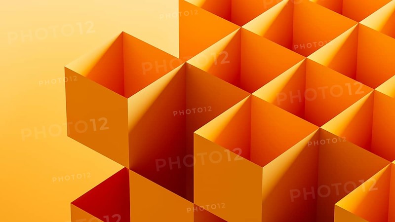 This graphic features an arrangement of 3D cubes in bright orange tones, forming an abstract composition against a seamless gradient backdrop