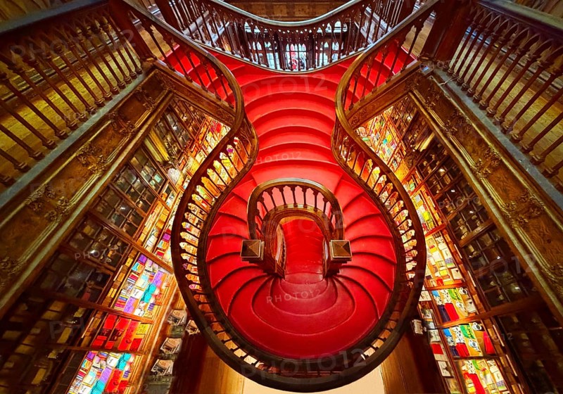 Livraria Lello, the Lello bookstore is one of the most beautiful bookstores in the world, interior view of the curved wooden staircase, Porto, Portugal