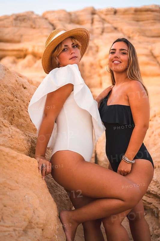 Lifestyle of a couple of Caucasian lesbian girls enjoying the summer on the beach