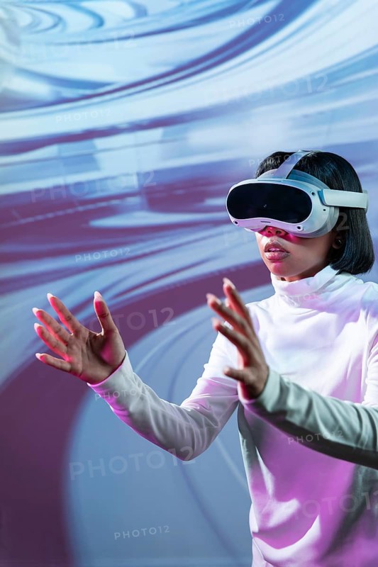 Latin woman wearing virtual reality glasses, fully immersed in a digital environment, interacting with virtual elements. Futuristic tech exploration and digital innovation concept