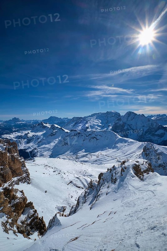 View of a ski resort piste and Dolomites mountains in Italy from Passo Pordoi pass. Arabba, Italy