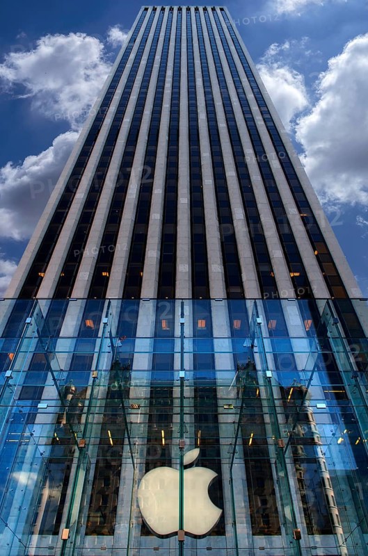 Apple logo in front of a skyscraper in Central Park, New York City, USA