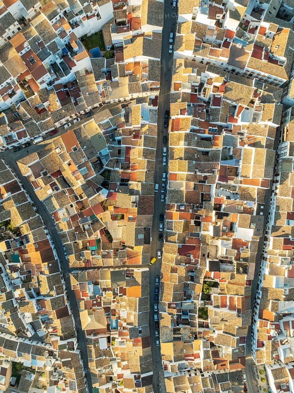 Streets and rooftops in the White Town of Olvera. Aerial view. Drone shot. Cádiz province, Andalusia, Spain