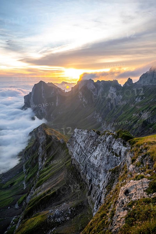 View over Säntis mountains into the valley of Meglisalp at sunrise, high fog in the valley, Säntis, Appenzell Ausserrhoden, Appenzell Alps, Switzerland