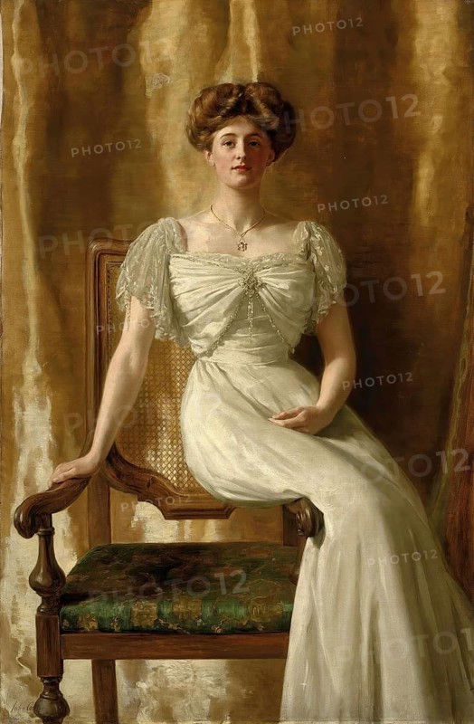 John Collier (born 28 January 1850 in London, died 11 April 1934), British writer and painter in the Pre-Raphaelite style, here his work: portrait of The Hon. Mrs Harold Ritchie, woman in an elaborate white dress sitting majestically on a wooden chair