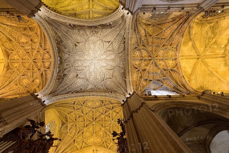 Large Gothic vault in the interior of the cathedral with finely worked ceiling, Seville, Andalusia, Spain
