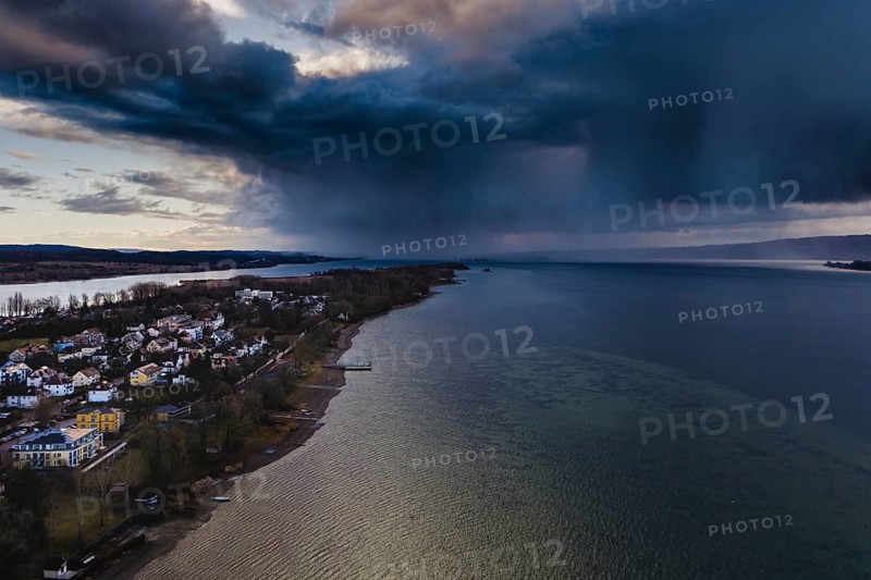 Weather picture, aerial view of the Mettnau peninsula near Radolfzell am Lake Constance, a low-hanging, passing rain cloud on the horizon over the island of Reichenau and Constance, heavy rain, severe weather Radolfzell am Lake Constance, district of Constance, Baden-Württemberg, Germany
