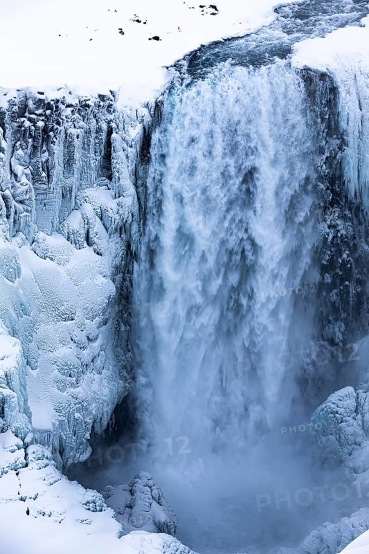 Dettifoss waterfall with icy and snow-covered rock face, Northern Iceland Eyestra, Iceland