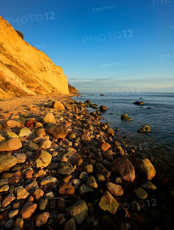Cliffs and boulders on the coast of the Baltic Sea in the evening light, Reddevitzer Höft, Mönchgut peninsula, Rügen island, Mecklenburg-Western Pomerania, Germany