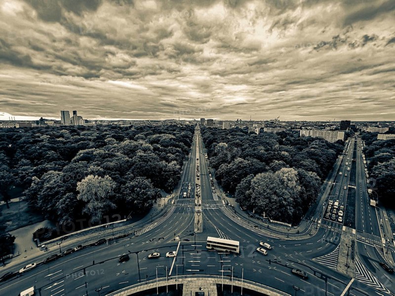 A dramatic black and white image of Berlin with an impressive avenue and cloudy sky, view from the Victory Column, Berlin