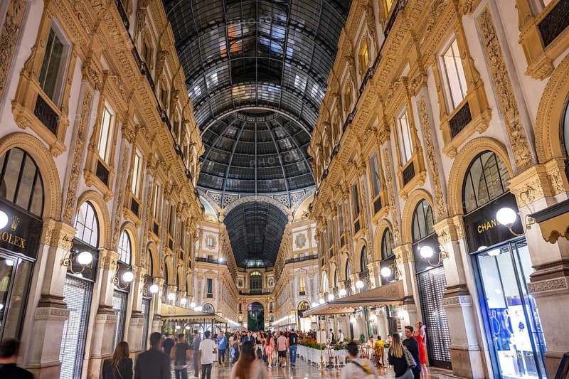View of the Galleria Vittorio Emanuele with its many luxury shops in Milan on a sunny day, Milan, Italy