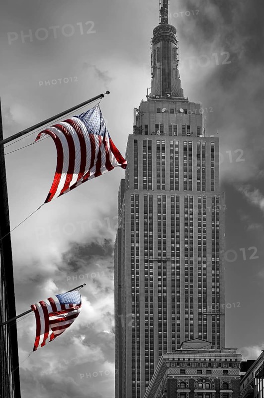 Waving US flag with Empire State Building, New York City, USA