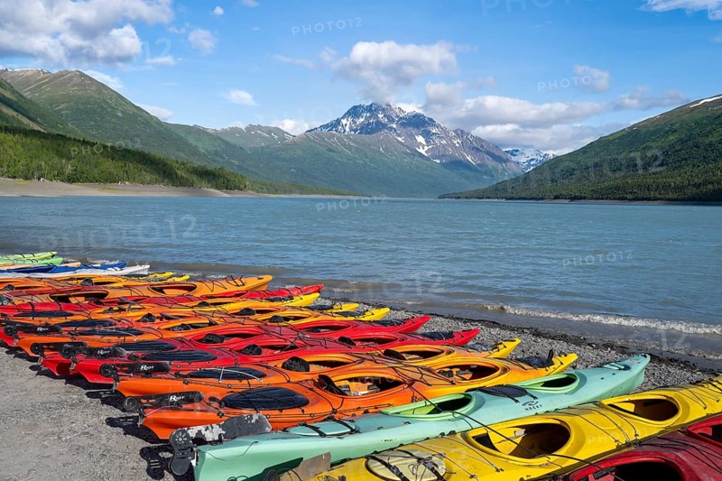 Colorful kayaks on lakeside, lake and mountains, Eklutna Lake, Chugach Mountains, Chugach State Park, Alaska, USA