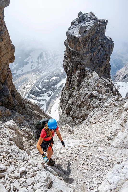 Female hiker climbs the Cima falconer mountain peak, Brenta Mountains, Brenta, Brenta-Adamello Natural Park, Trentino, Italy
