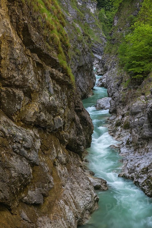 The Lammer creek is flowing fast through the Lammerklamm on a sunny hiking day