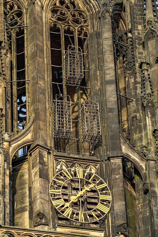 The iron baskets of the Anabaptists on the tower of the parish church of St. Lamberti in Münster, North Rhine-Westphalia, Germany