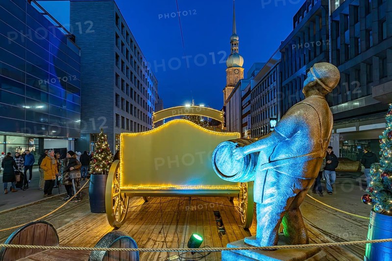 Light installation beer carriage with horses at Dortmund's Christmas market at dusk, Dortmund, North Rhine-Westphalia, Germany