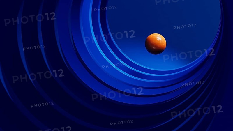 A vibrant orange sphere hovers within a dynamic arrangement of blue geometric shapes, creating a striking abstract visual effect