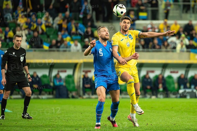 WROCLAW, POLAND - MARCH 26, 2024: Qualifications for UEFA Euro 2024. Final play-off match Ukraine - Iceland 2:1. In action Sverrir Ingason (L) Roman Yaremchuk (R).