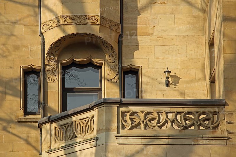 House façade and balcony with decorated balustrade on Art Nouveau villa, decorations, yellow sandstone, Humboldtstraße, Wiesbaden, Taunus, Hesse, Germany