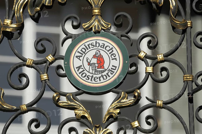Emblem with figurehead Alpirsbacher Klosterbräu, beer brand, inscription, metal grid, Alpirsbach, Nordschwarzwald, Black Forest, Baden-Württemberg, Germany