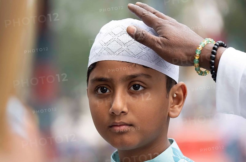 Muslim child arrives to Eid al-Fitr prayer at Eidgah, on March 21, 2026 in Guwahati, India. Muslims make up a sizeable minority of India's population and celebrate Eid along with muslims across the world at the end of Ramadan