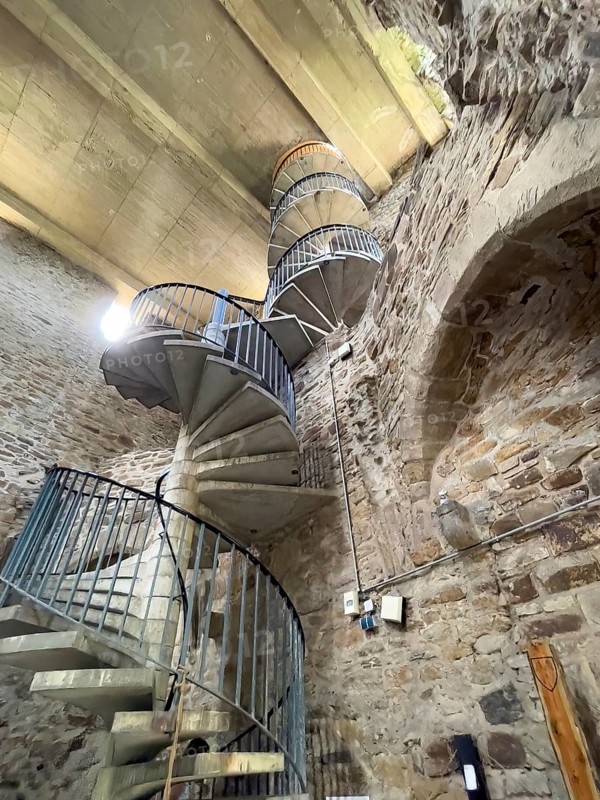 View of high spiral staircase in restored historic castle tower of Altendorf Castle in Burgaltendorf district, above modern concrete ceiling as weather protection and viewing platform, Essen, North Rhine-Westphalia, Germany