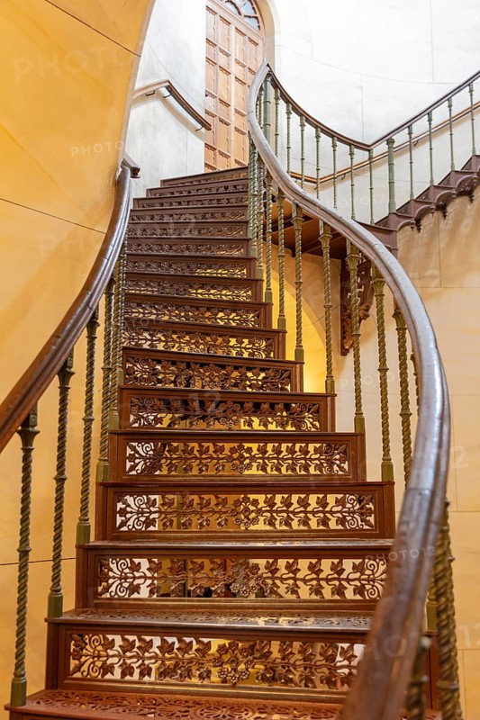 Wooden staircase with artistically designed balustrades, curved shape and elegant, Rügen, Granitz Castle