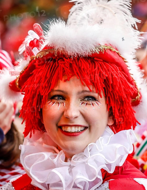 Colourfully costumed carnivalists celebrate carnival in Cologne, on Weiberfastnacht the street carnival is traditionally opened on the Alter Markt, which then reaches its climax on Rosenmontag, Cologne, Rhineland, North Rhine-Westphalia, Germany