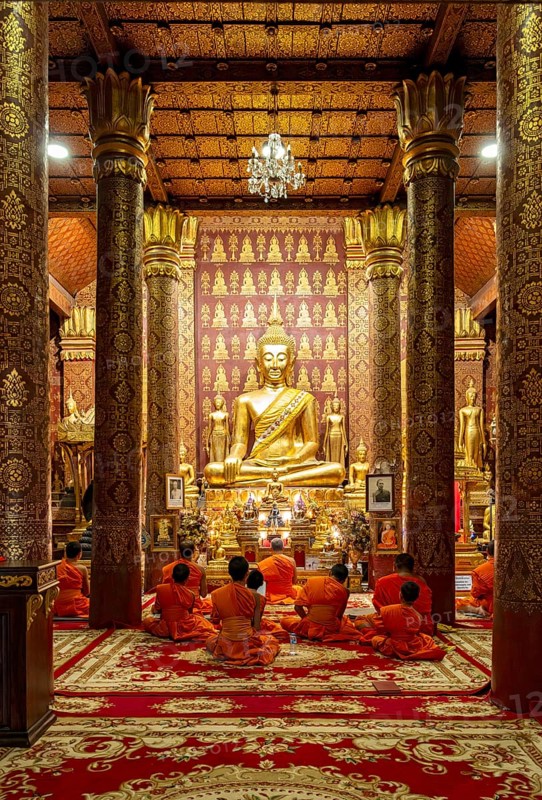 Monks praying at Wat Sensoukaram, Luang Prabang, Laos