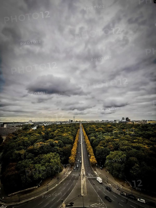 Dramatic sky over a tree-lined avenue in Berlin, view from Victory Column, Berlin