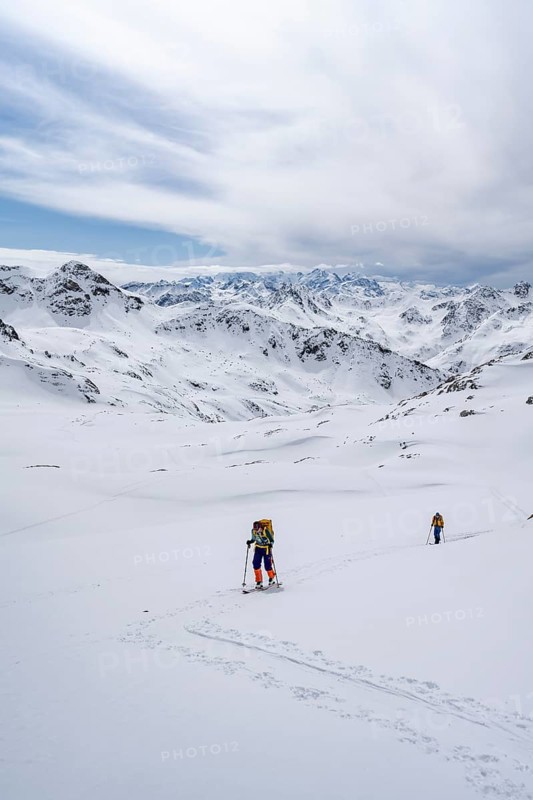 Ski tourer in mountain landscape with snow, ascent to Grialetsch Scharte, Bündner Haute Route, Albula Alps, Rhaetian Alps, Grisons, Switzerland