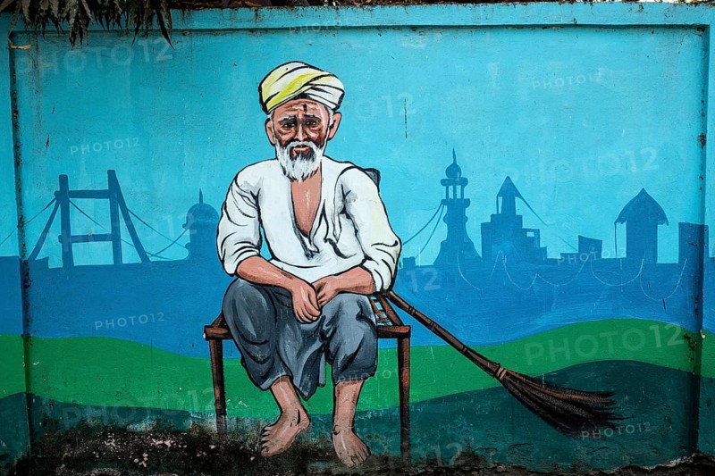 Mural painting representing an old man with a broom, Odisha, India