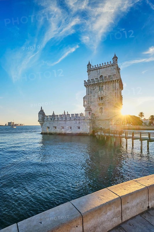 Belem Tower or Tower of St Vincent, famous tourist landmark of Lisboa and tourism attraction, on the bank of the Tagus River (Tejo) on sunset. Lisbon, Portugal