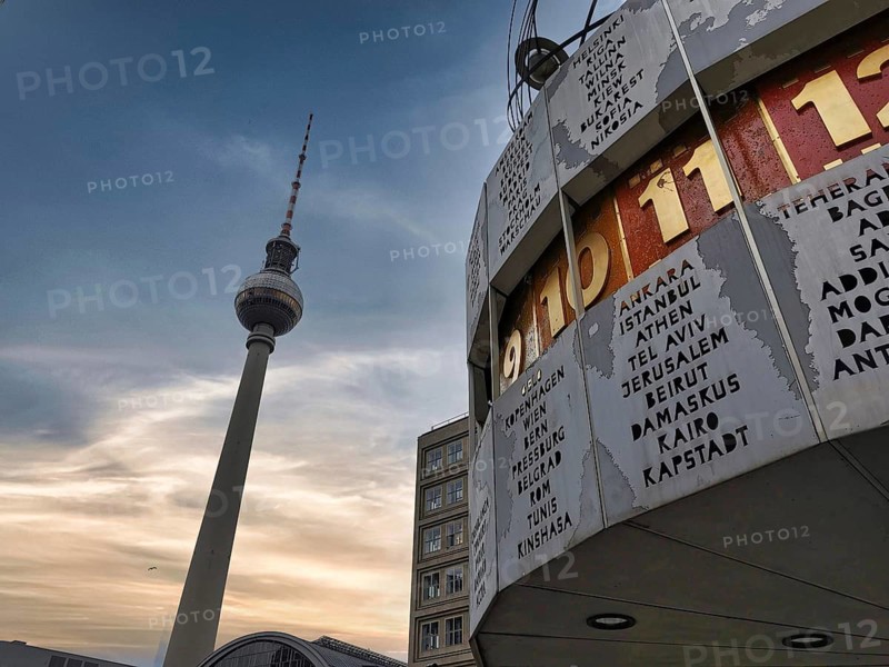 Cloudy sky over the Berlin World Clock and the Berlin TV Tower at Alexanderplatz, Alex, Mitte, Berlin