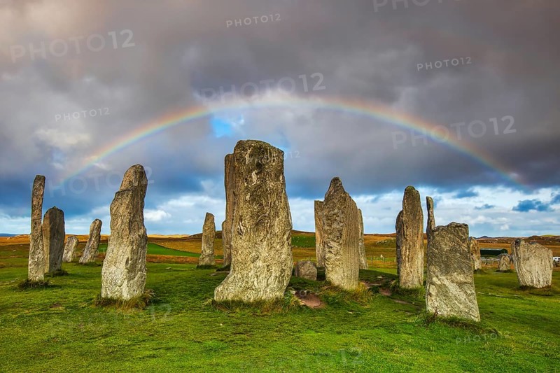 The Calanais Standing Stones are an extraordinary cross-shaped setting of stones, located on the Isle of Lewis in the Outer Hebrides, Scotland. They were erected 5, 000 years ago, predating England's famous Stonehenge, and served as an important site for ritual activity for at least 2, 000 years