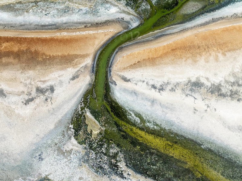 Marshes and streams at low tide in the Walvis Bay Lagoon. Aerial view. Drone shot. Walvis Bay, Namibia