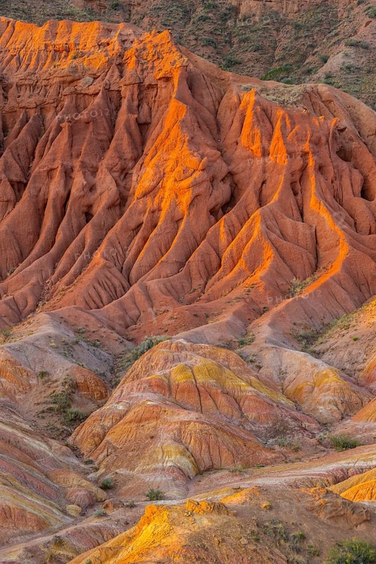 Red rocks, canyon of eroded sandstone formations, red and orange sandstone rocks, fairytale gorge, Skazka, Tosor, Kyrgyzstan