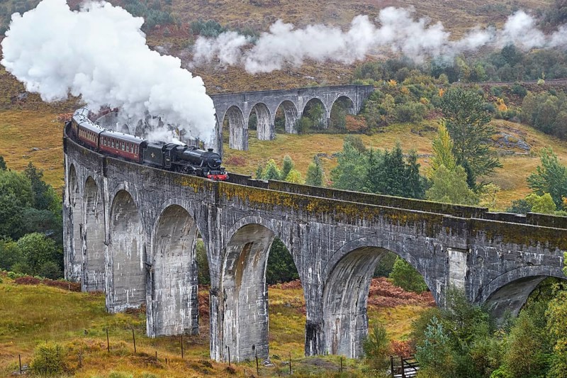 Scotland. Glenfinnan Viaduct, a renowned feat of Victorian engineering and the longest concrete railway bridge in Scotland. Hogwarts Express train made famous by the Harry Potter