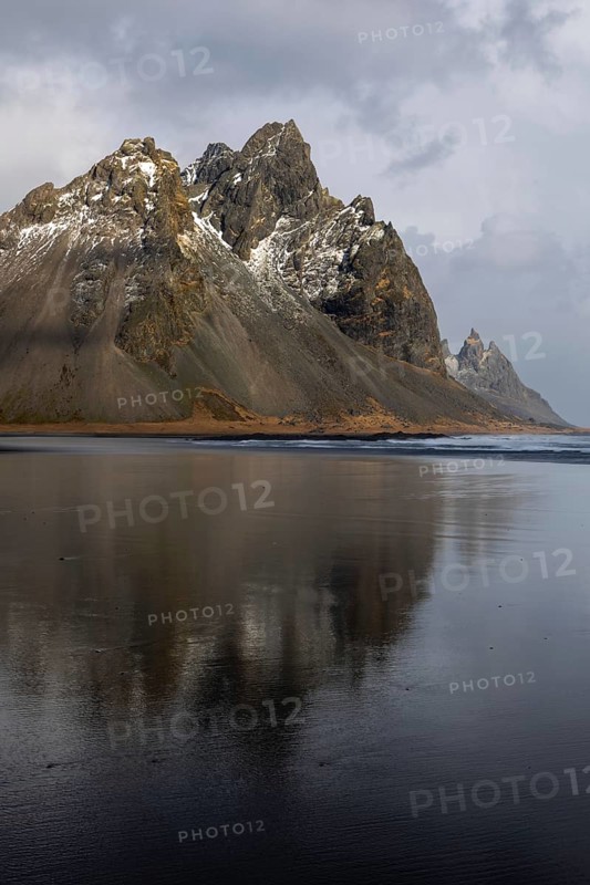 Reflection of Vestrahorn on black lava sandy beach, sea, winter, Stokksnes, Vestrahorn, Klifatindur, Höfn, Iceland, Scandinavia