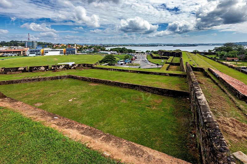 View from a fortress across an urban landscape towards a river, The fortress of Galle in Sri Lanka