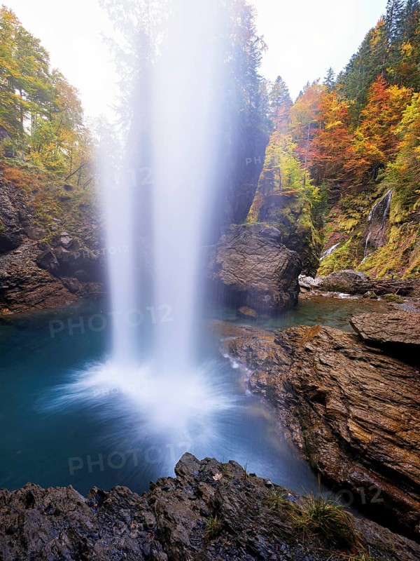 Waterfall mountain list in autumn-colored surroundings, Linthal, Klausenpass, Canton of Glarus, Switzerland