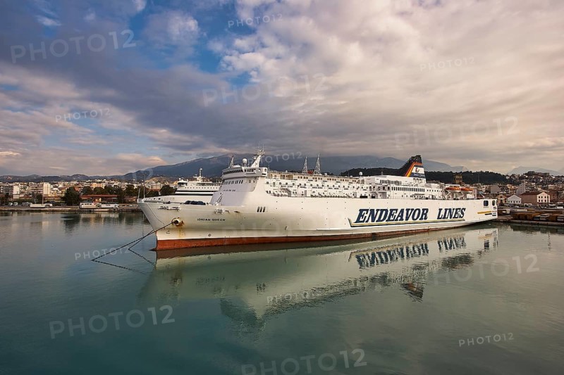 Large passenger ship in port with reflecting water and cloudy sky, Old ferry port in central Patras, Ferries, Patras, Peloponnese, Greece