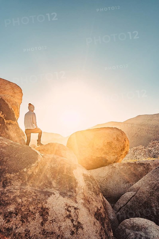 Woman hiking at sunrise in Joshua Tree National Park