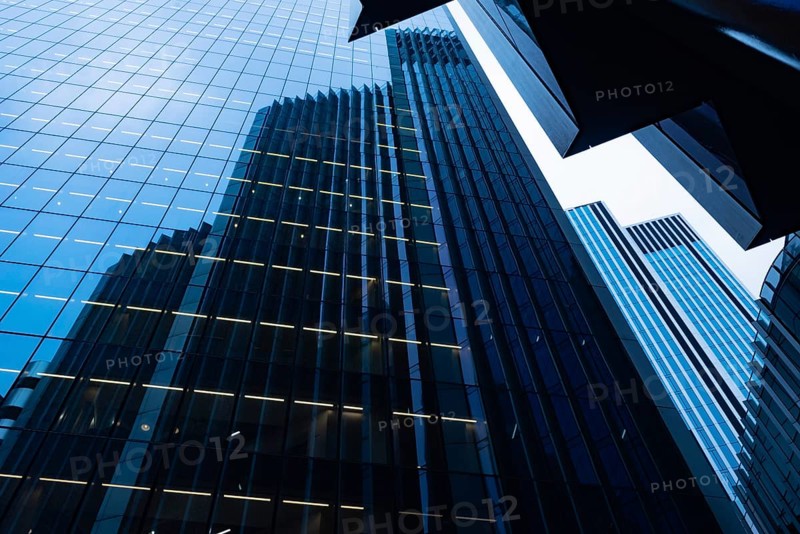 Modern abstract reflections in glass fronted commercial office buildings in the financial district of the British capital London