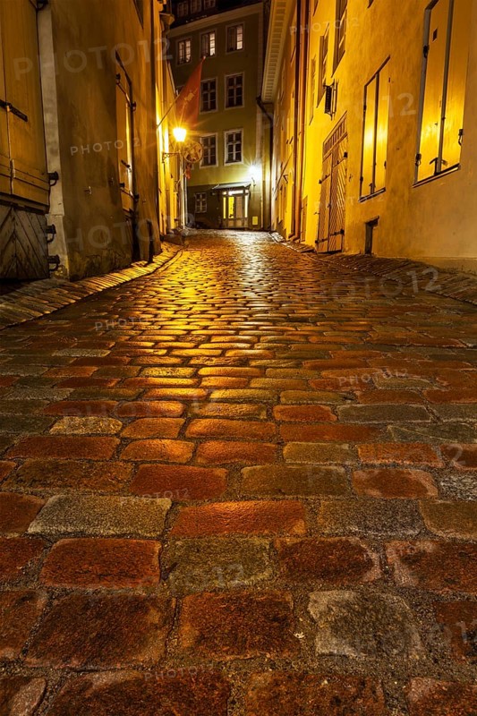 Tallinn Old Town street with cobblestones in night, Estonia