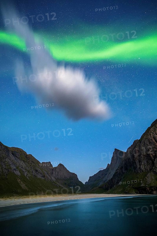Northern lights at Horseid beach, sandy beach with mountains, Lofoten, Norway