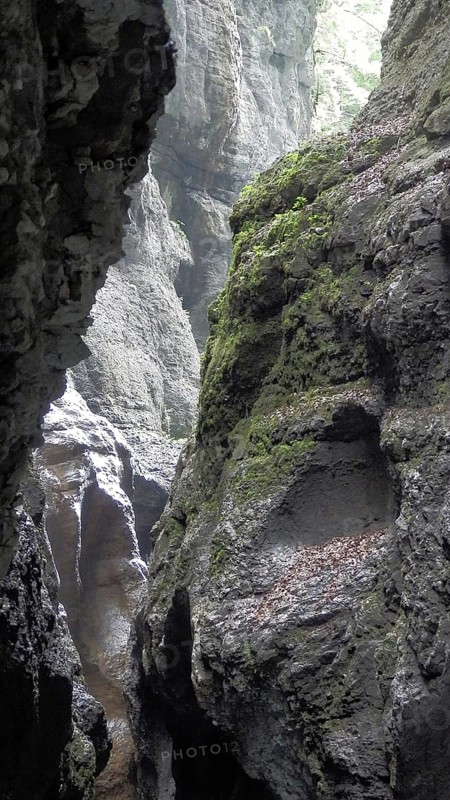 Impressive rock formations and gorges with moss-covered surfaces, Partnachklamm, Garmisch-Partenkirchen, hiking through the Reintal valley to the Zugspitze
