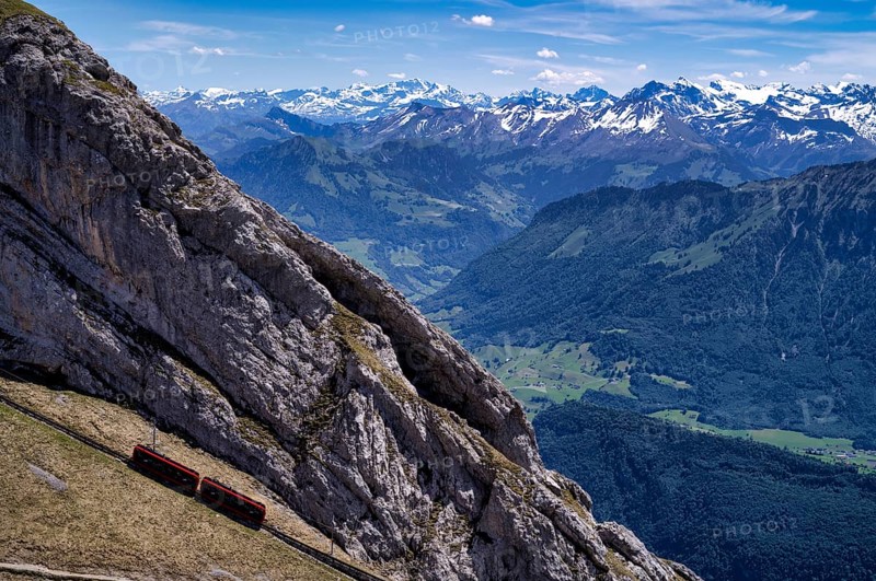 Pilatus railway, steepest cogwheel railway in the world from Alpnach to the Pilatus, behind it Swiss mountain range, Alps, snow-covered, Canton Lucerne, Switzerland